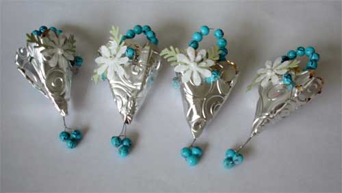 tussie mussies made with silver material and trimmed with turquoise beads