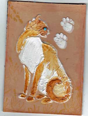 artist trading card in coral color showing cat made from a stencil
