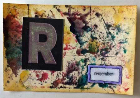 postcard decorated with alcohol inks and with raised letter R